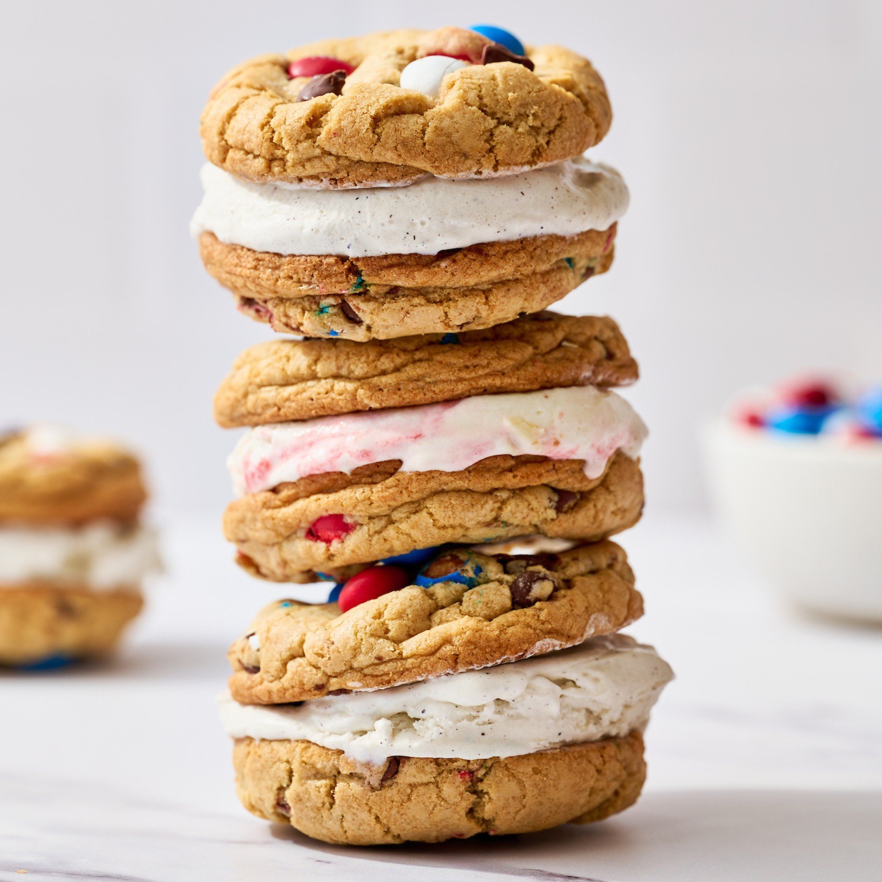 three 4th of July Ice Cream Sandwiches stacked on a white background.