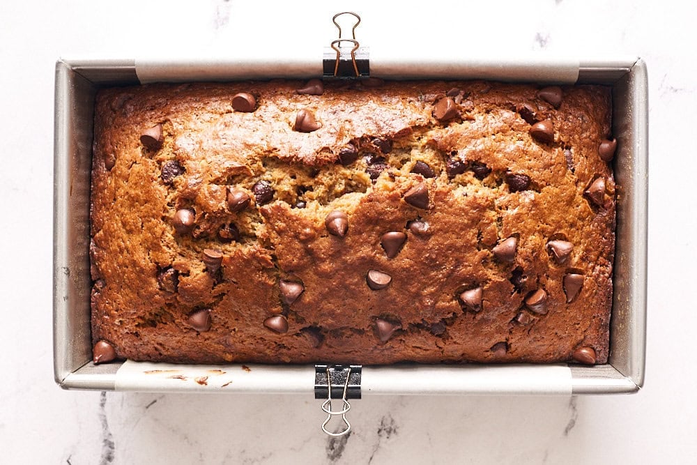 overhead view of freshly baked banana bread in a metal pan
