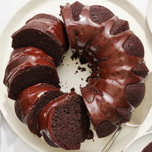 slices of homemade chocolate bundt cake on a serving platter