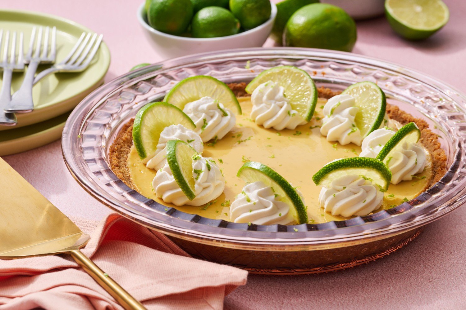 whole key lime pie in a glass pie pan.