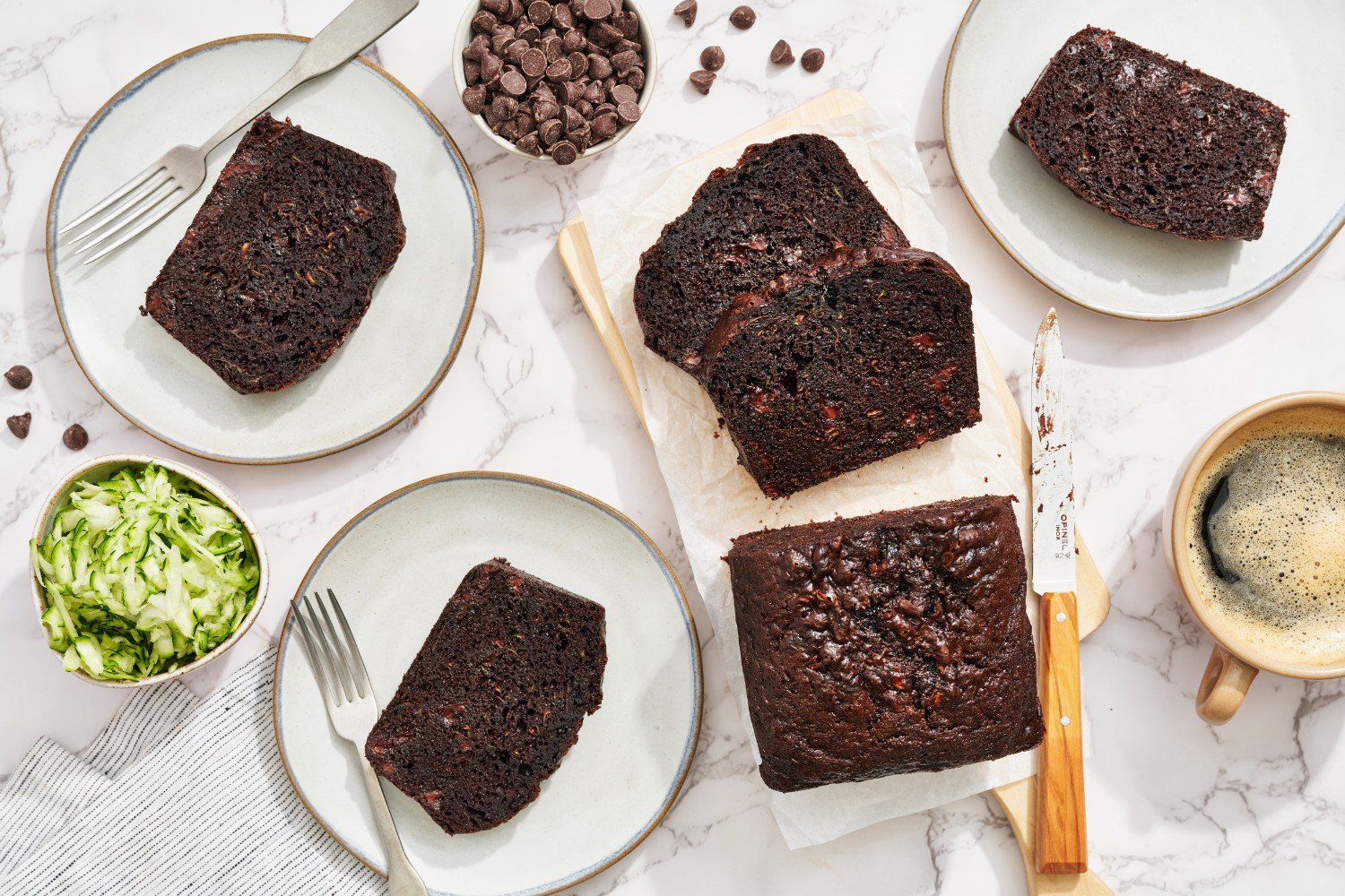 slices of chocolate zucchini bread on plates, ready to serve.