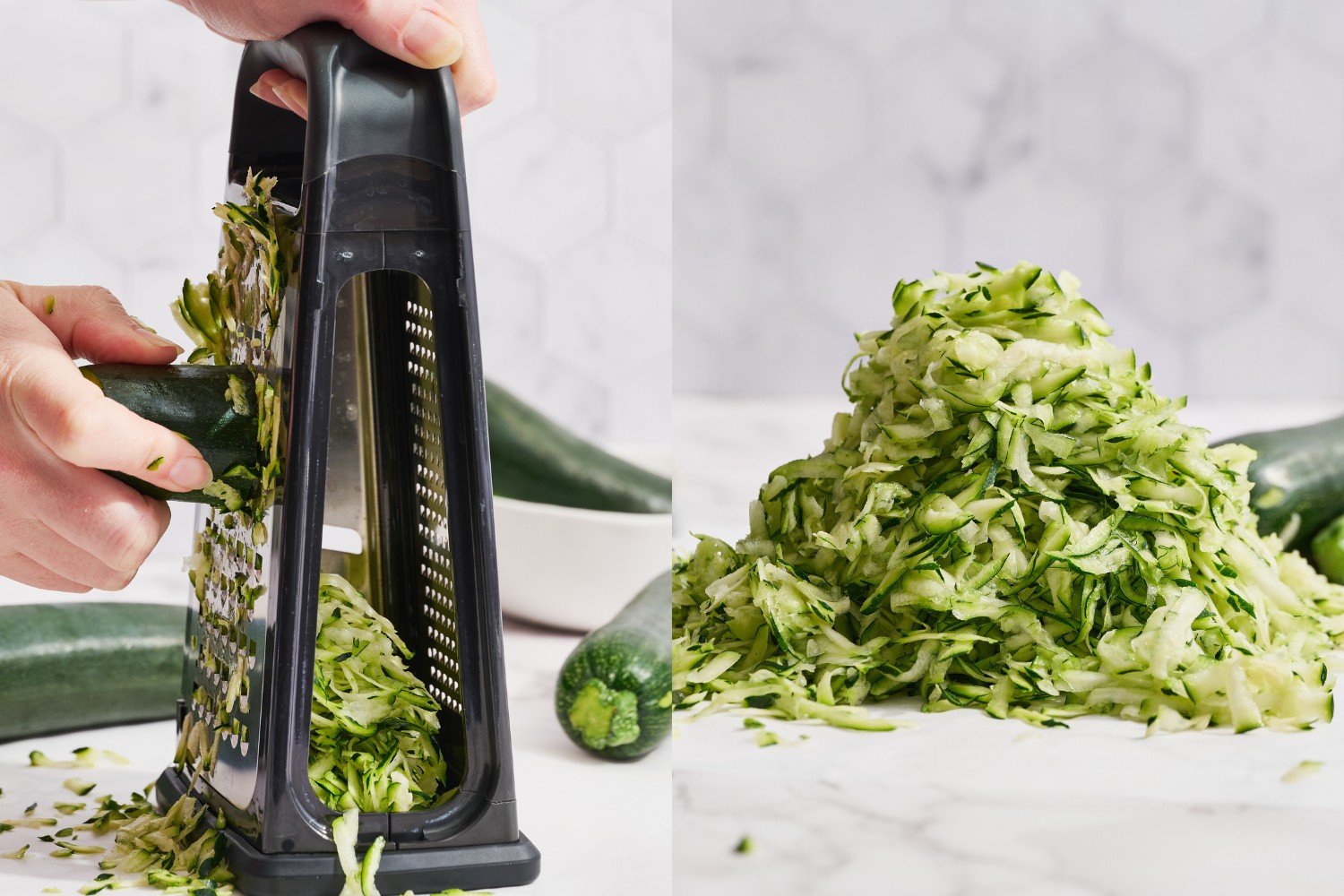 a hand using the large holes on a box grater to shred fresh zucchini.