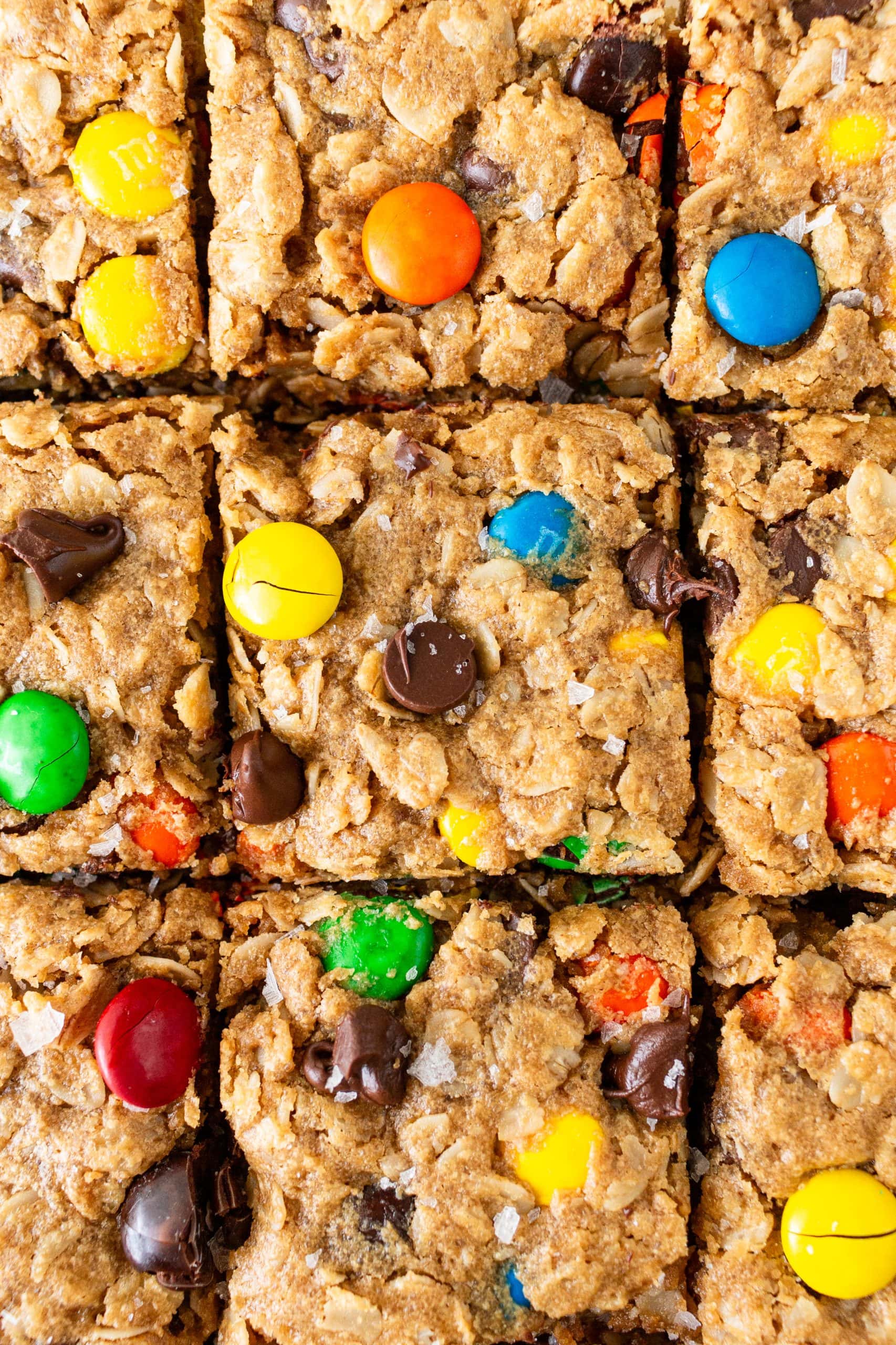 overhead of monster cookie bars sliced into 9 pieces
