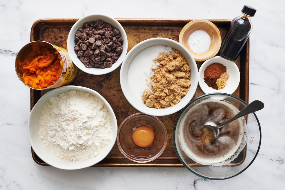 mise en place ingredients for this recipe in bowls on a baking sheet, ready to assemble.