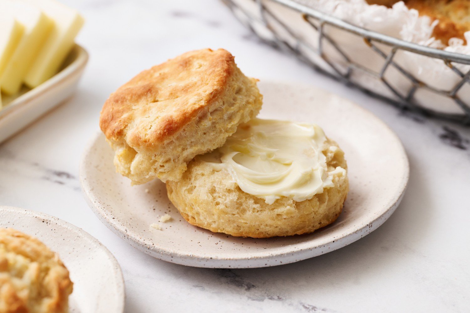 a biscuit cut in half and slathered with butter.