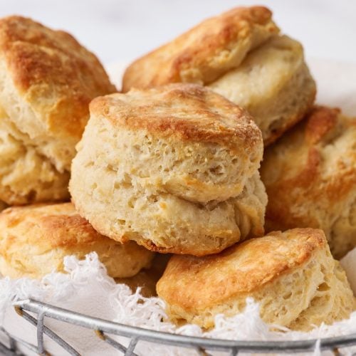 a basket of baked buttermilk biscuits.