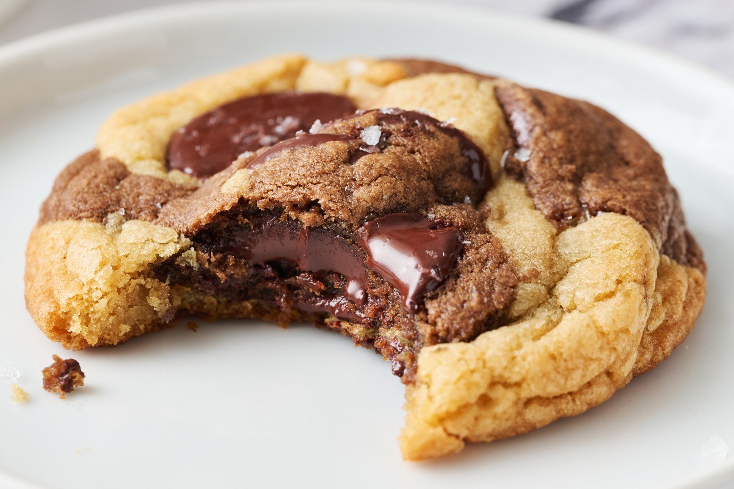 one marbled cookie with a bite taken out.