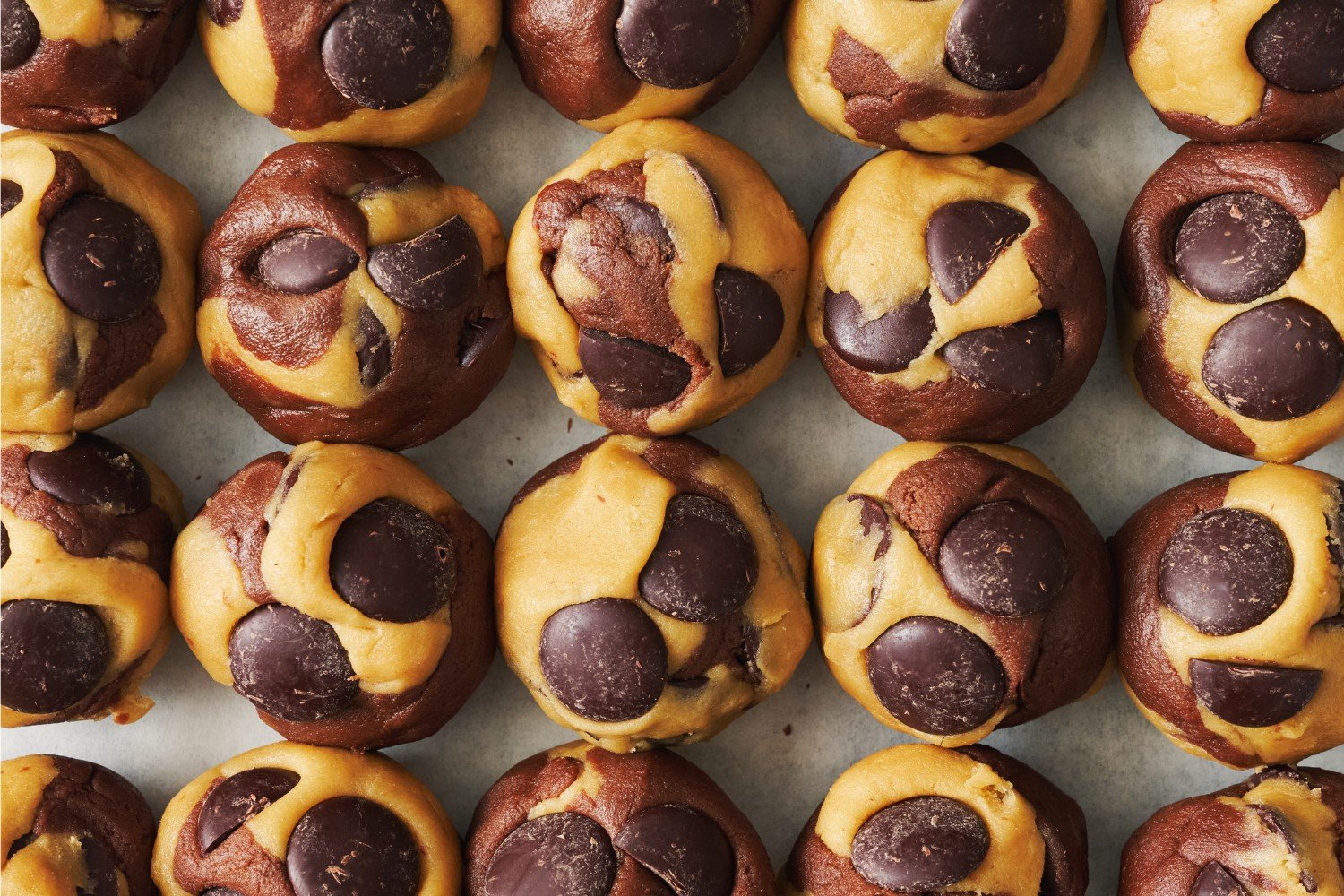 balls of shaped Marbled Chocolate Chip Cookie dough, ready to chill or be baked.