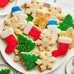 a plate of iced and decorated sugar cookies.