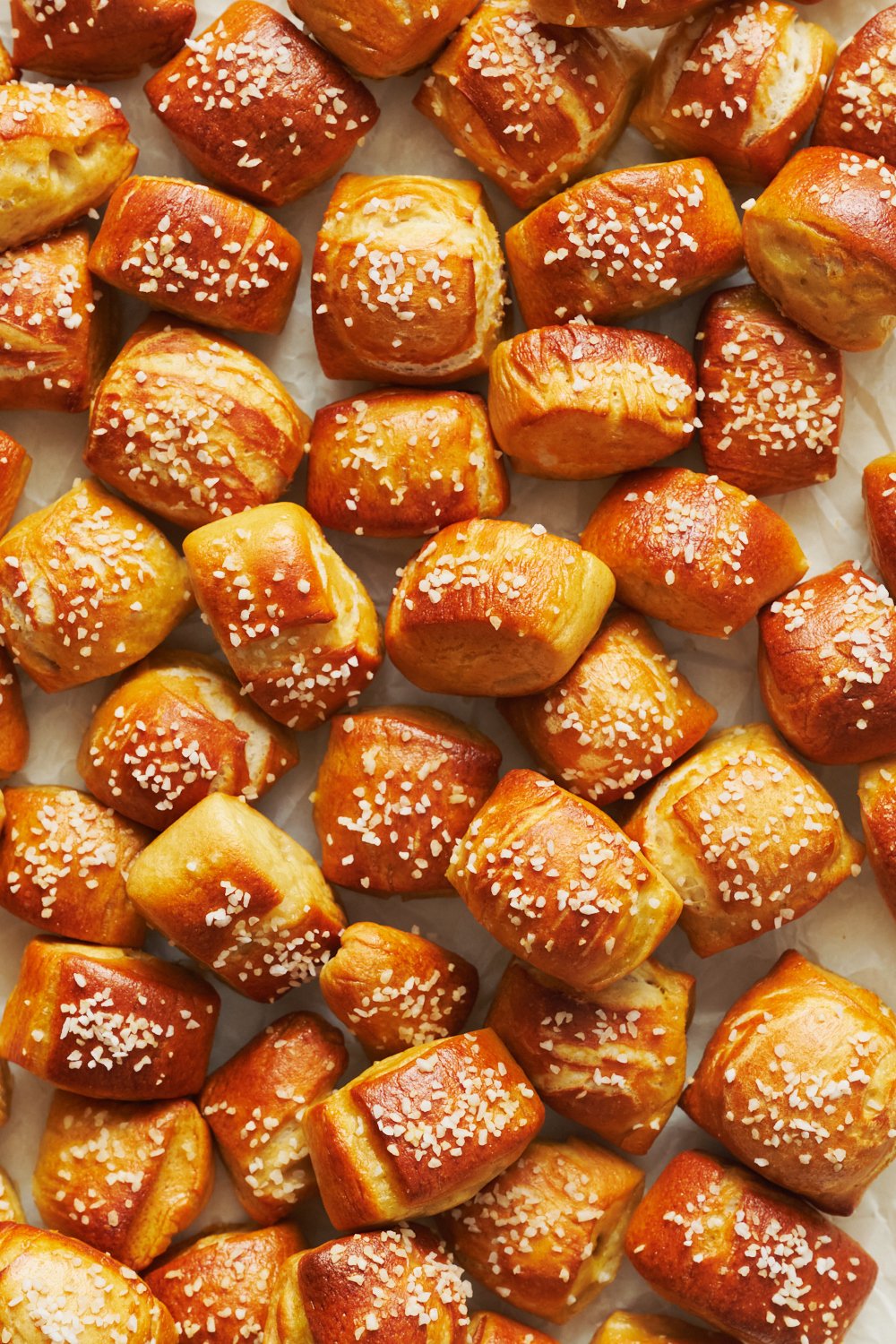 a baking sheet filled with freshly-baked pretzel bites.