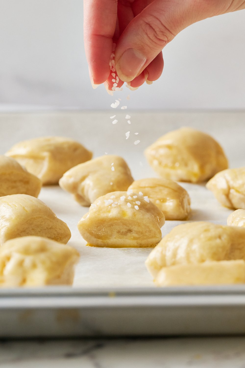 topping the pretzel bites with pretzel salt before baking.