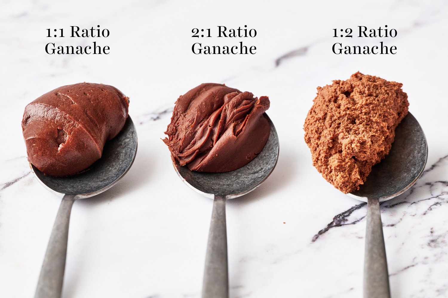 three metal spoons holding some finished ganache, displaying the different ratios of chocolate to cream.