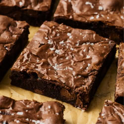 slices of Malted Brownies on brown parchment paper.