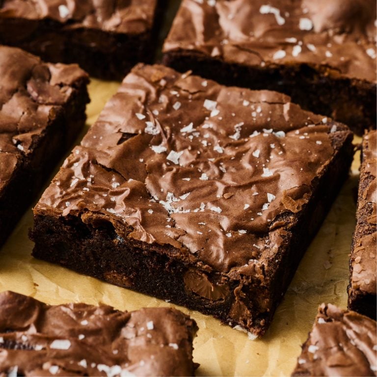 slices of Malted Brownies on brown parchment paper.
