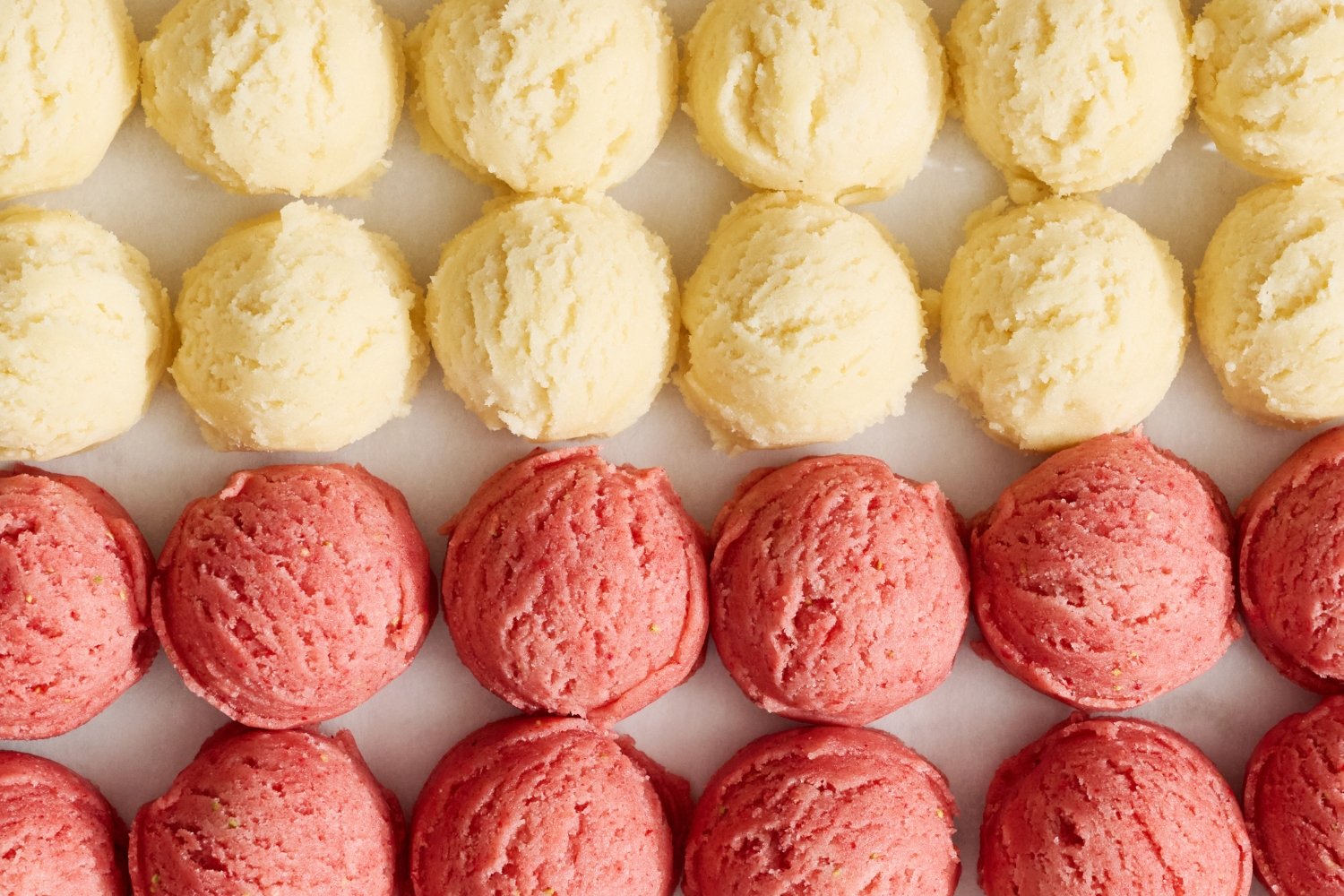 portioned balls of cookie dough lined up.