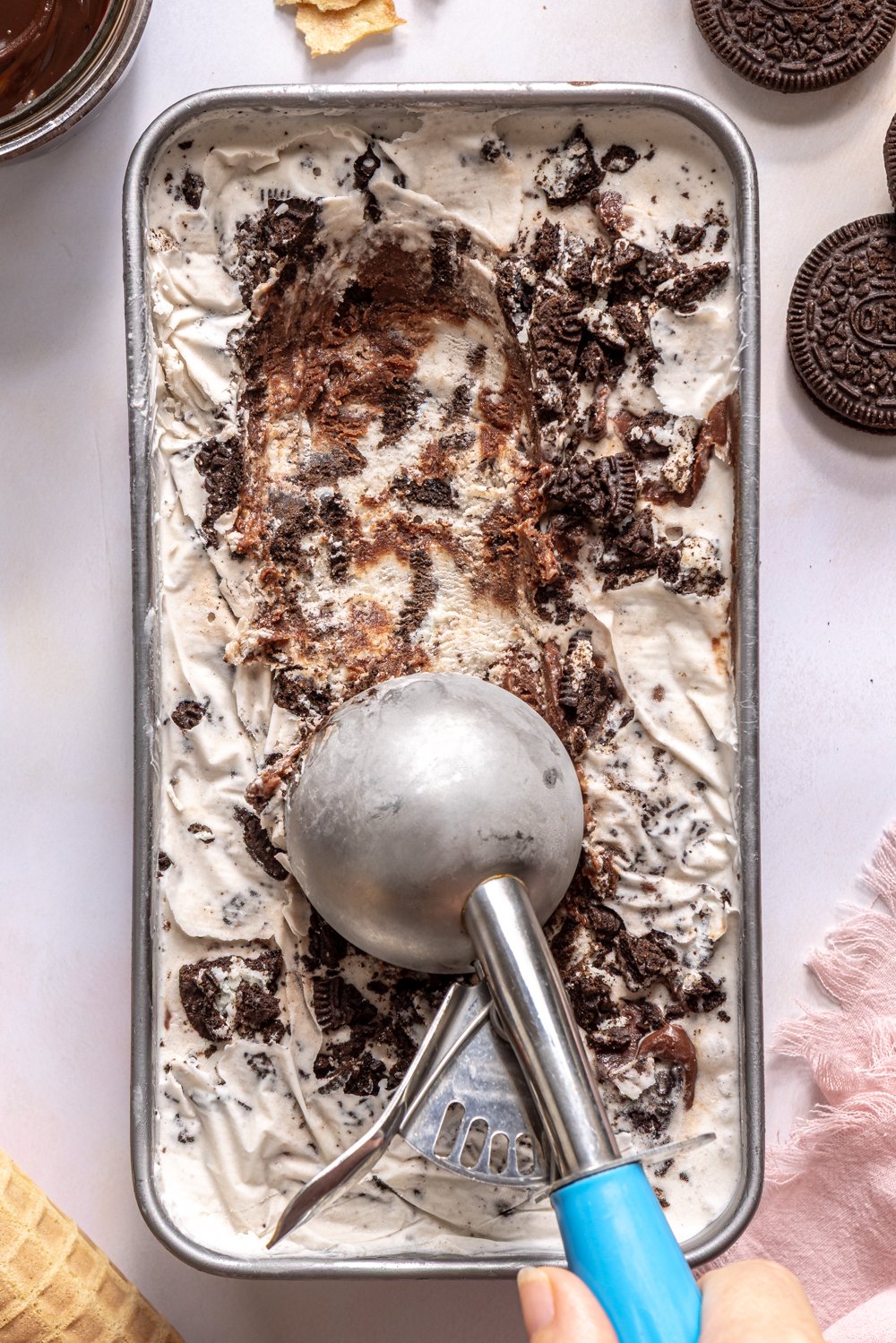 scooping ice cream from metal container