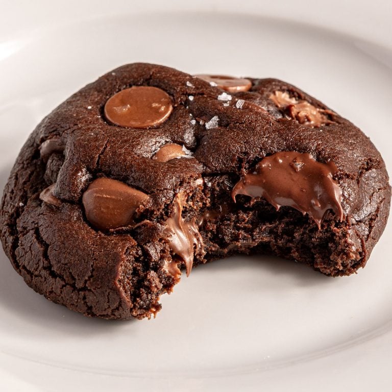 thick chocolate cookie on plate with bite taken out