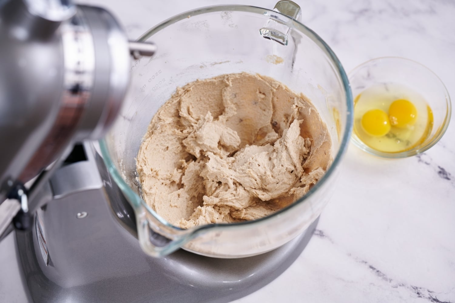 overhead view into mixing bowl to show creamed butter and sugar