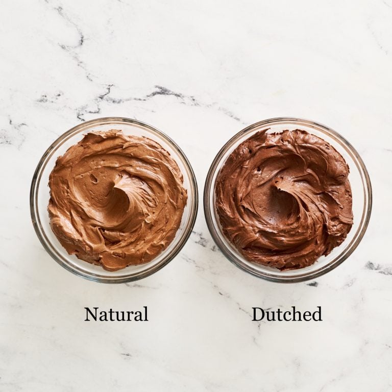 a bowl of buttercream made with natural cocoa powder on the left, and the same size bowl of buttercream made with Dutch process cocoa powder on the right