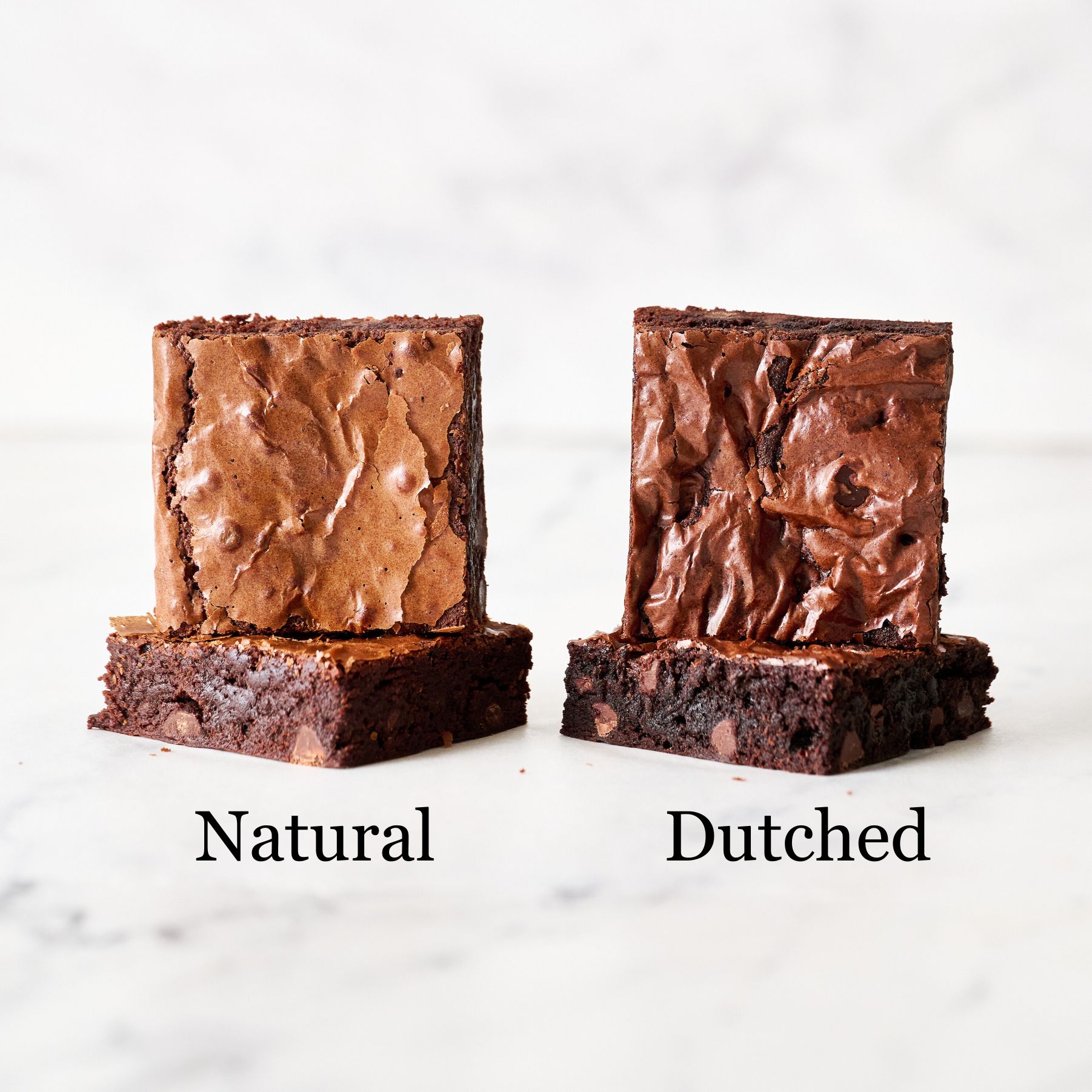 two brownies on the left made with natural cocoa, two brownies on the right made with Dutched cocoa