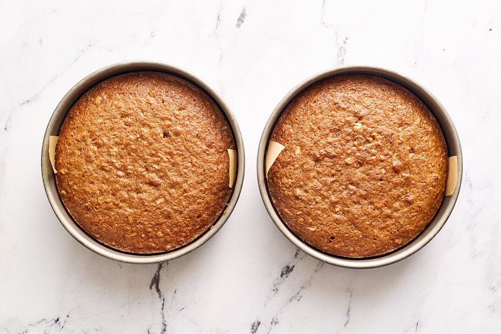 freshly baked carrot cake layers in pans
