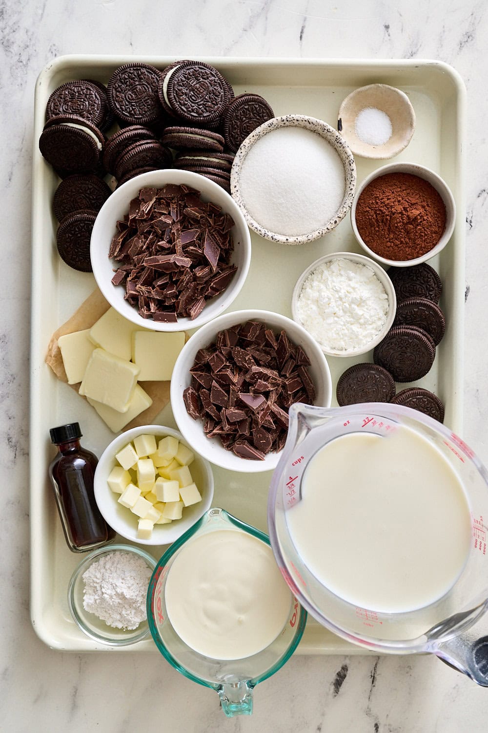 All ingredients portioned and ready on a rimmed cream colored sheet pan
