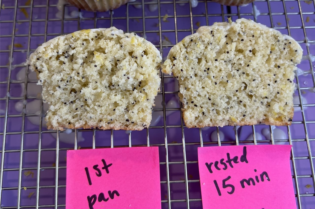 iPhone photo of 2 lemon poppyseed muffins compared, one baked immediately and one baked after resting the batter 15 minutes, showing a much taller muffin top