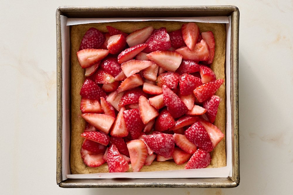 shortbread dough topped with strawberry mixture before baking again