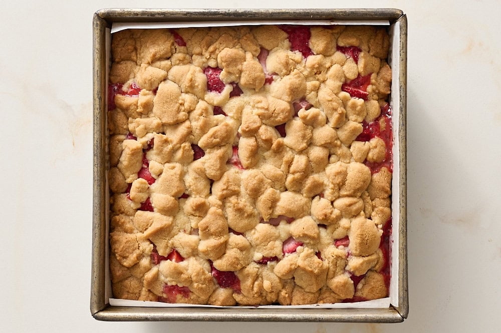 overhead of strawberry cobbler bars in pan, freshly baked