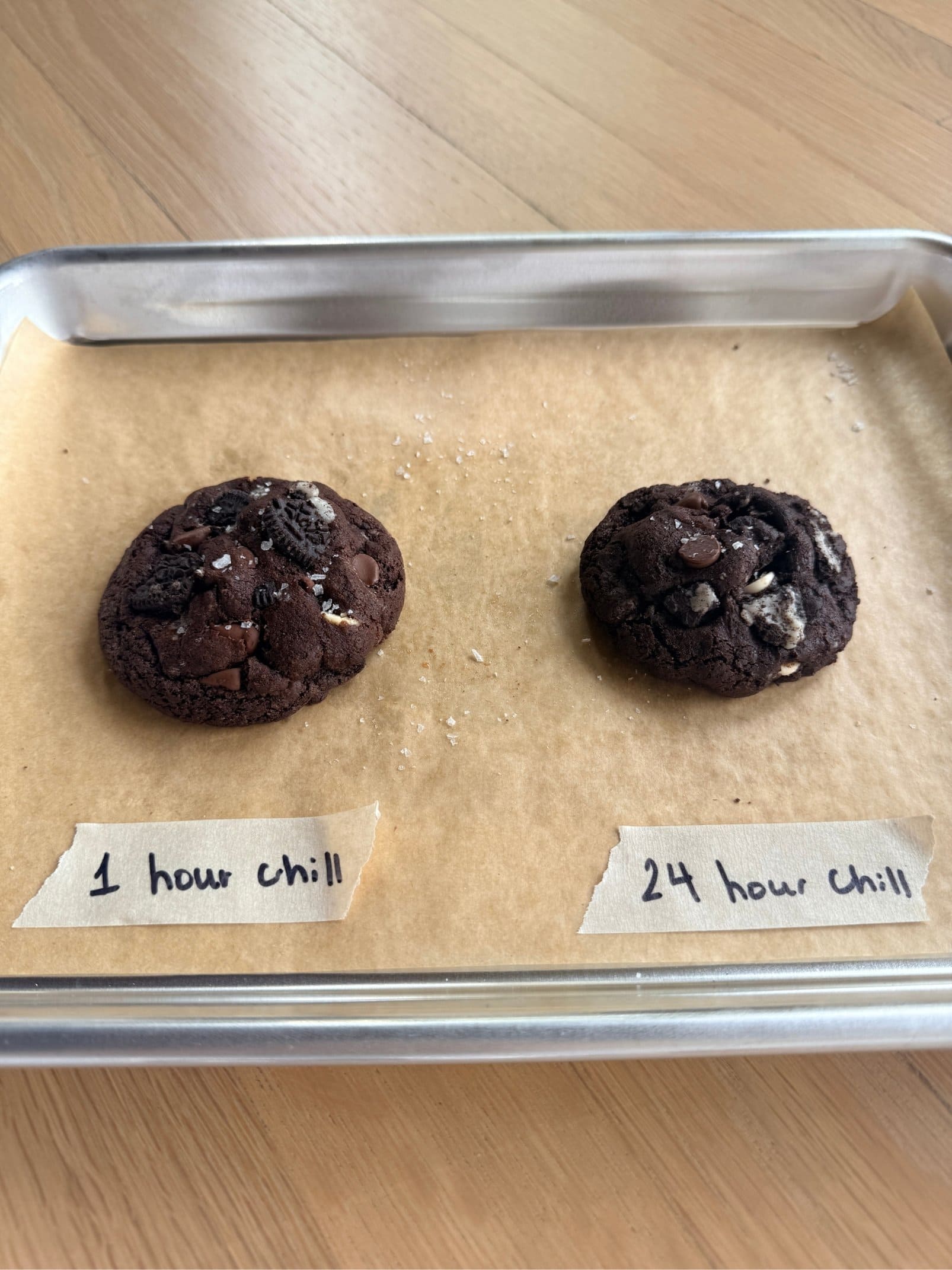 iPhone test kitchen photo showing two cookies baked from different chilling intervals - 1 hour and 24 hours