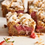 eye level shot of strawberry cobbler bars to show gooey strawberry filling