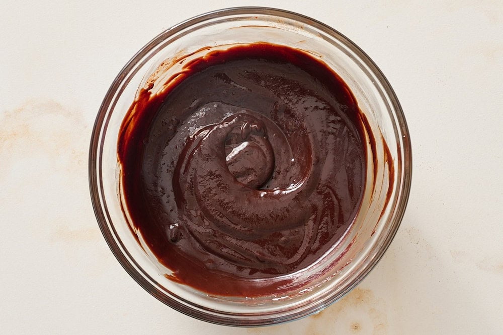 raspberry chocolate ganache filling in glass bowl, before chilling