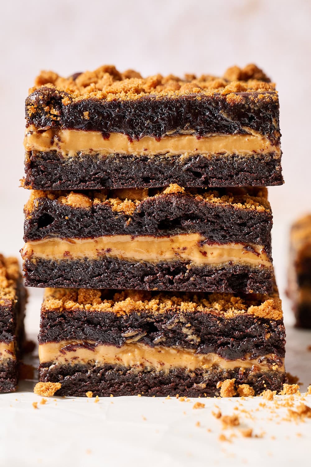 eye level stack of three Biscoff Brownies showing perfect fudgy brownie layers with a slightly gooey Biscoff filling
