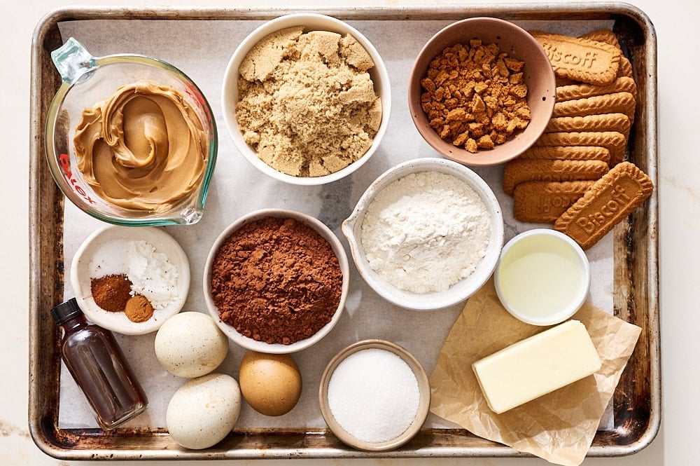 ingredients for Biscoff Brownies measured and ready on a rimmed baking tray