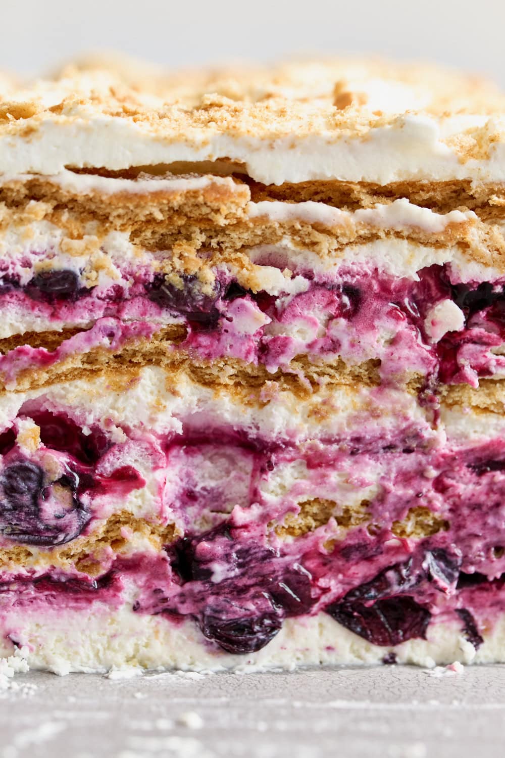 up close eye level view of the layers of the blueberry lemon icebox cake