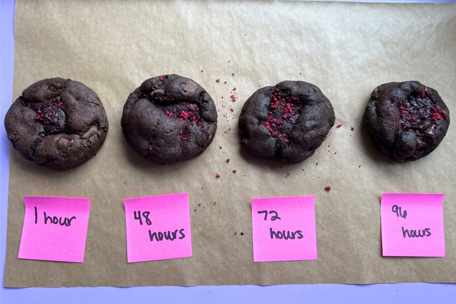 overhead view of four cookies, each baked after varying chill times