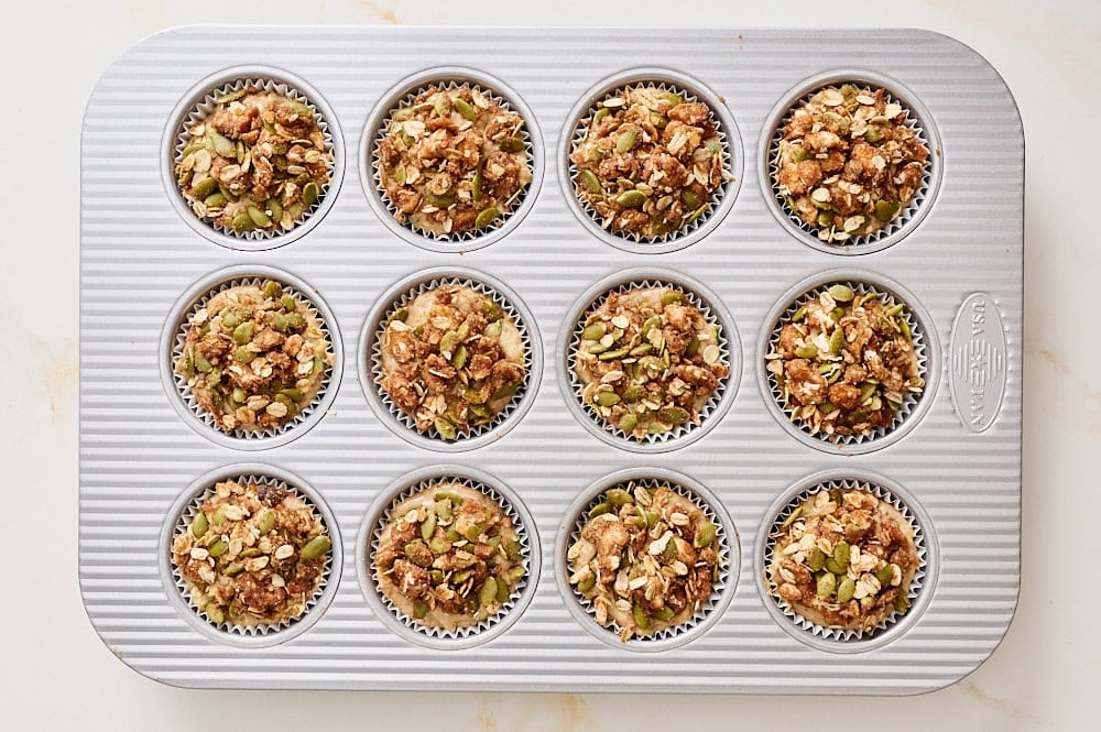 overhead view of muffins before baking baked