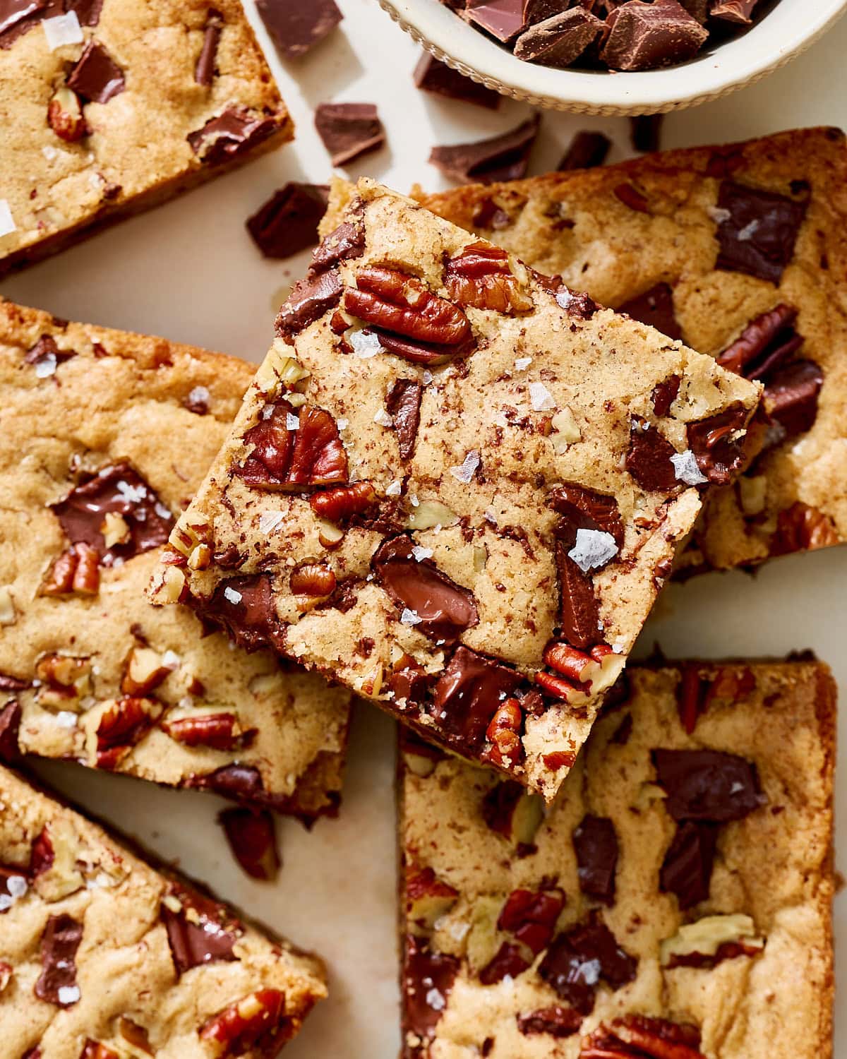 overhead view of bars of bourbon pecan chocolate chunk blondies