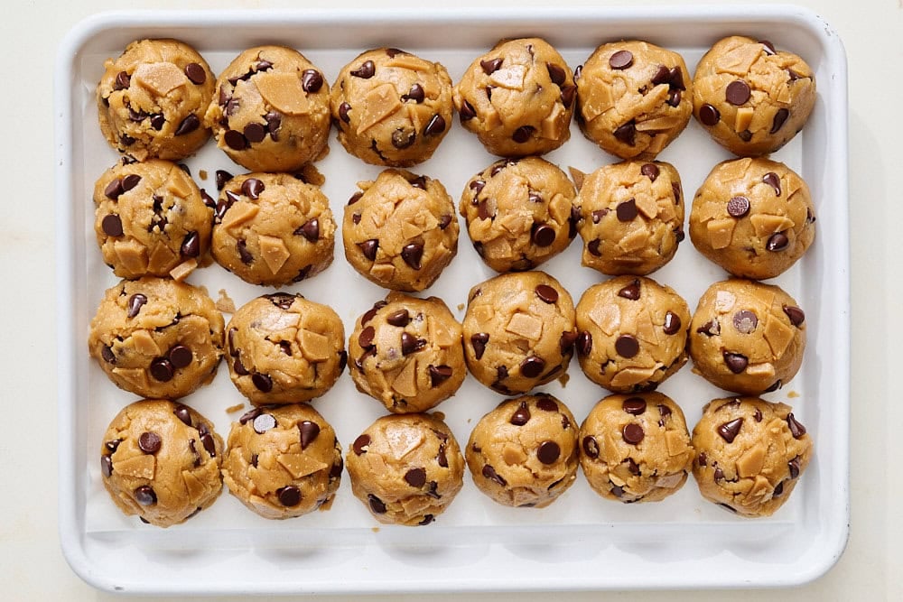 overhead view of batch of peanut butter toffee chocolate chip cookie dough scoops